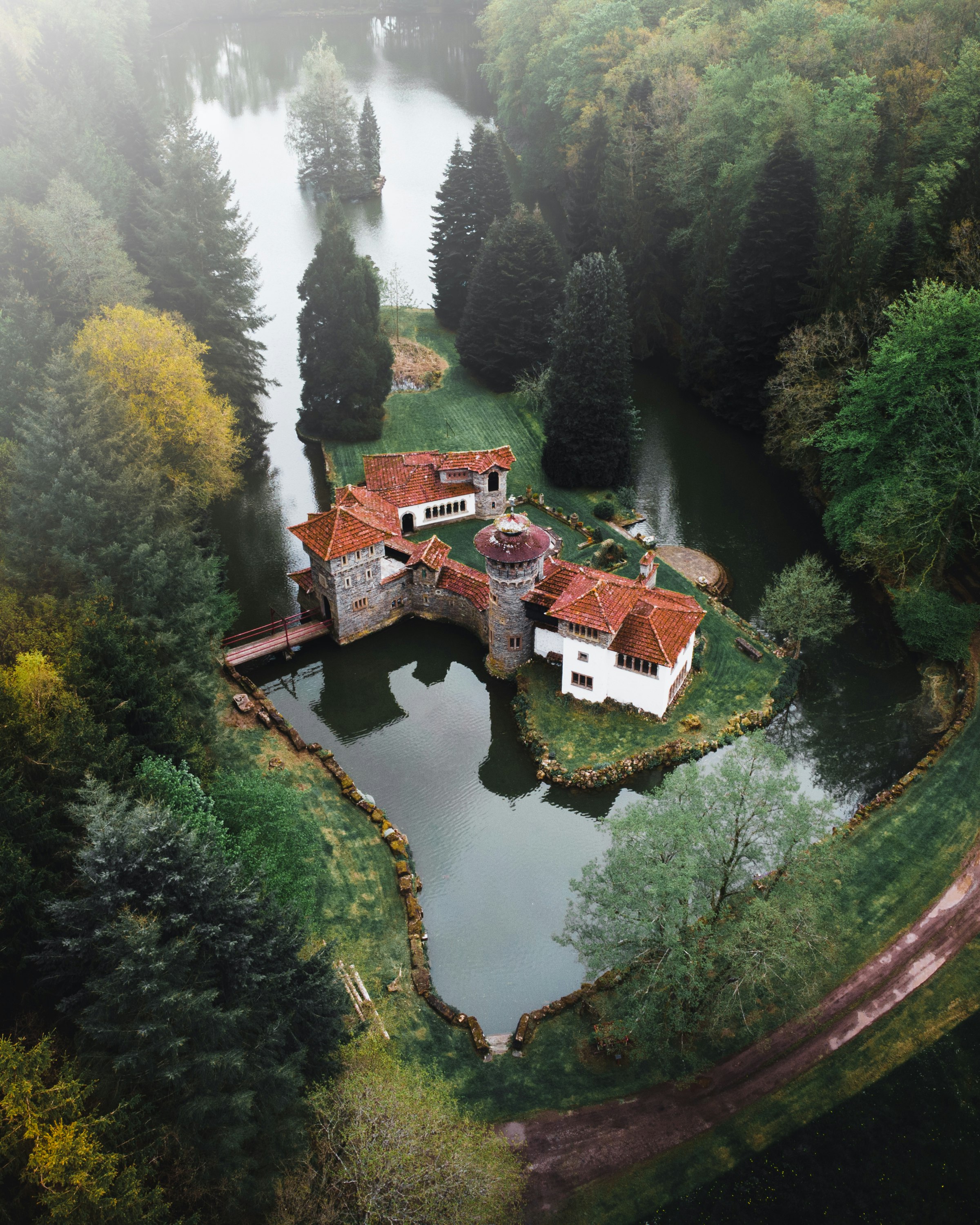 brown and white house on river